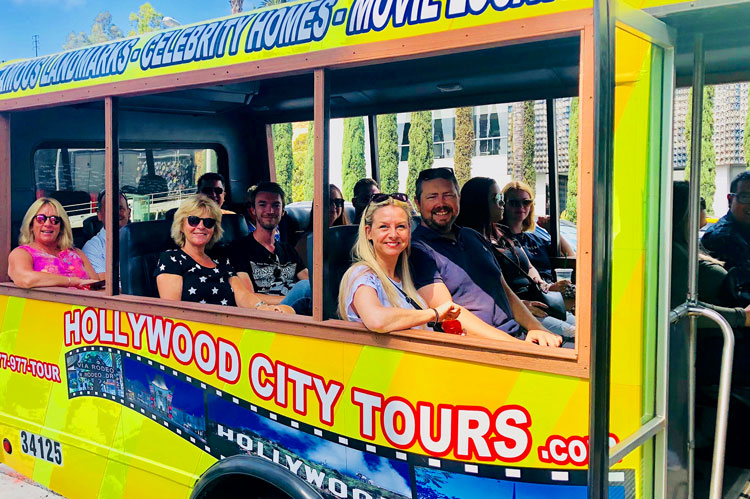 Happy passengers enjoying a Los Angeles Tour on our Hollywood Tour Bus