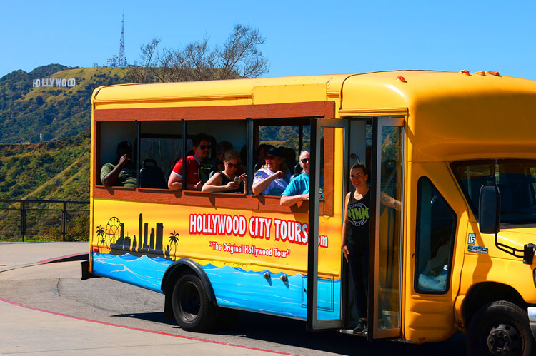 Guests riding a Tour Bus during a scenic Hollywood Tour through Los Angeles