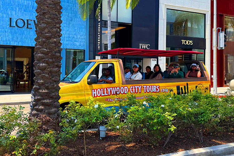 Hollywood Bus Tours driving past Hard Rock Cafe on a guided Hollywood Tour of Hollywood Boulevard